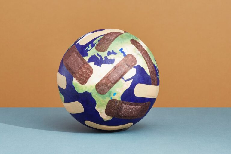 ouch around the world globe with bandages