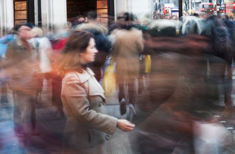 Woman on busy sidewalk