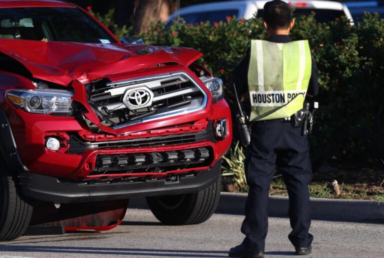 houston police officers investigating pedestrian killed by motorist